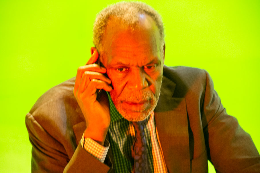 Danny Glover performing a telephone scene against a green screen